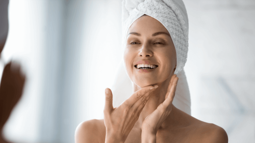 woman with towel on head looki